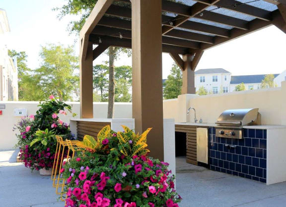 Poolside kitchen with grills at Link Apartments® Mixson, North Charleston, SC