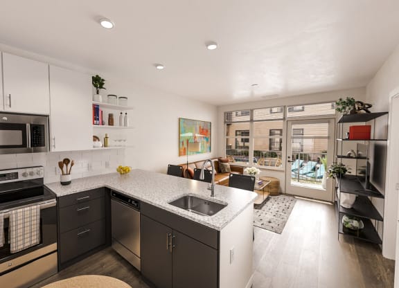 a kitchen with a large counter top and a sink