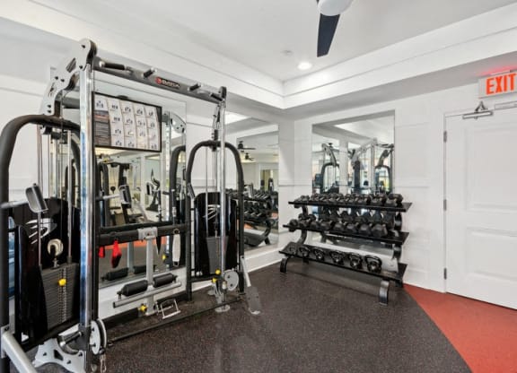 the gym is equipped with weights and cardio equipment at Link Apartments® Brookstown, Winston Salem, 27101