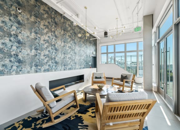 a view of a spiral staircase in a building with rows of wooden benches  at Link Apartments® H Street, Washington, Washington