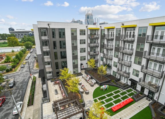 an aerial view of an apartment complex with a green courtyard at Link Apartments® Mint Street, Charlotte, NC, 28203