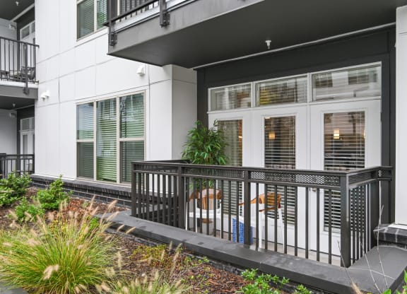 the front of a building with windows and a balcony at Link Apartments® Mint Street, Charlotte, North Carolina