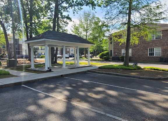 a gazebo in the middle of a parking lot