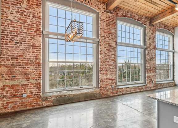 Spartanburg, SC with granite countertops, stone floors, stainless steel appliances and large windows.
