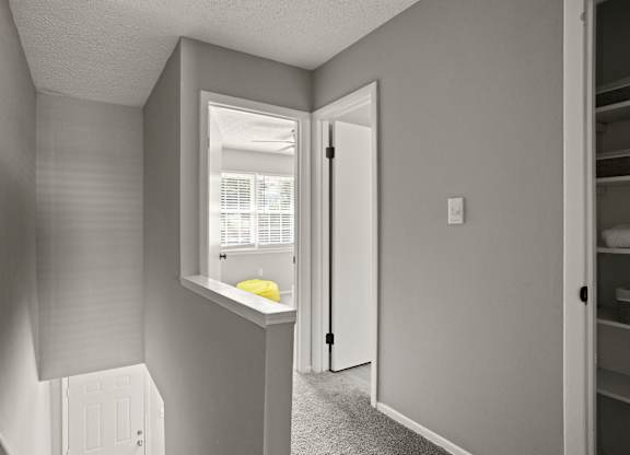 A small room with a window and a door.