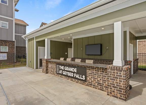 The Grande at Geyser Falls Luxury Apartments Pool Bar with TV