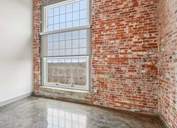 Unstaged living room in Converse Mill Lofts in Spartanburg, SC