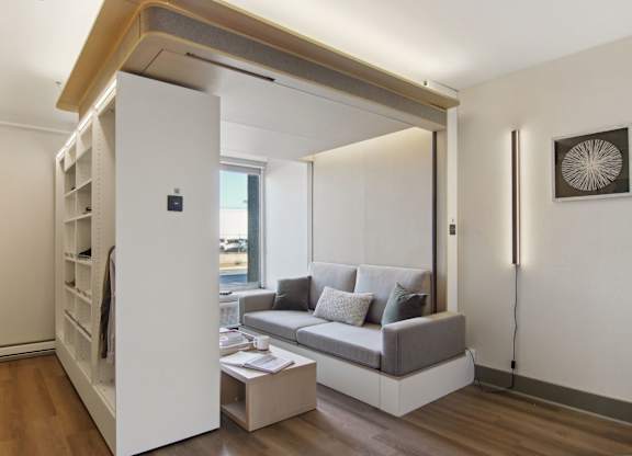 Greenville, SC Studios For Rent | Flathouse Studios | Bedroom with Ori Expandable Bed, Pocket Closet, and Large Window.