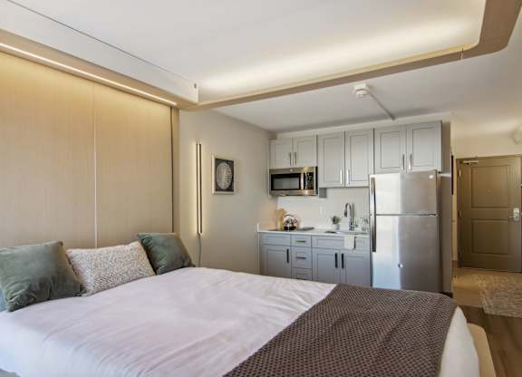 Greenville, SC Studios For Rent | Flathouse Studios | Bedroom with Ori Expandable Bed, Pocket Closet, and Large Window.