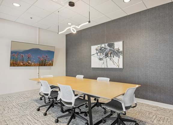 a conference room with a long table and chairs