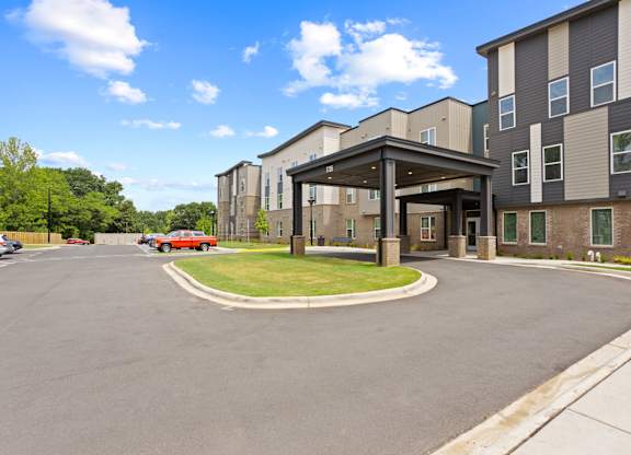 Ovata at Reedy Creek Senior Apartments in Charlotte NC Exterior view of entrance and covered entry drive
