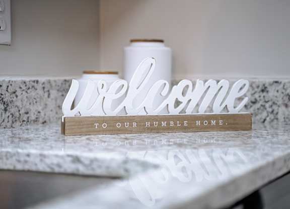 A wooden sign that says