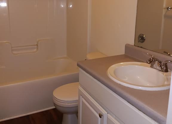 a bathroom with a sink toilet and a bath tub
