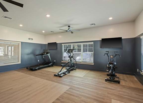 Peaks of Lexington Apartments Fitness Center with elliptical, treadmill and stationary bike