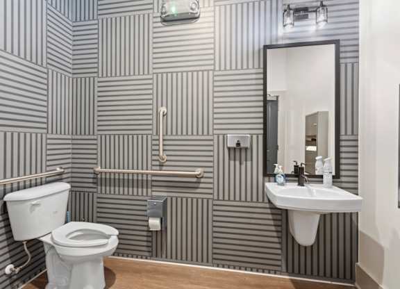 Peaks of Lexington Clubhouse Bathroom with Striped Pattern on Walls