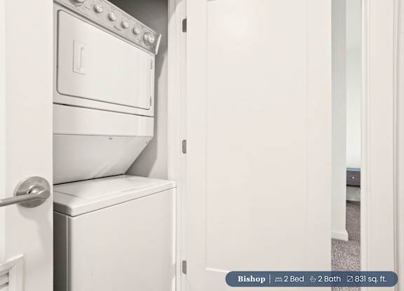 A white oven and toilet are in a small room.