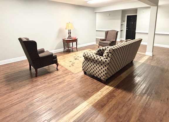 Brookside Gardens community room with two chairs and a couch