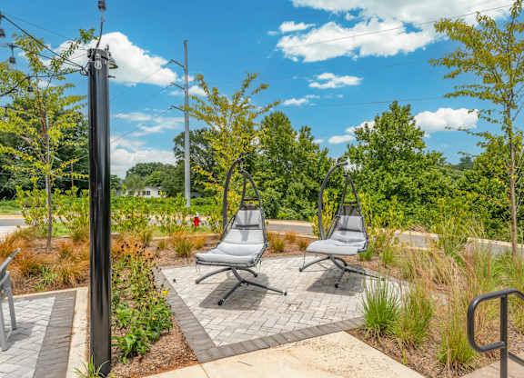 Hanging Chairs outside of the pool at Converse Mill Lofts Apartments in Spartanburg SC