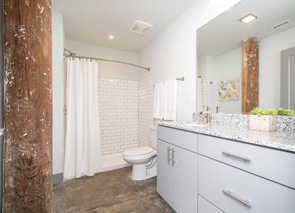 Converse Mill Lofts Luxury Apartments Bathroom with Granite Countertops
