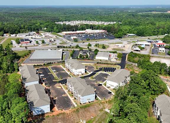 An aerial view of a large industrial area with multiple buildings and parking lots.