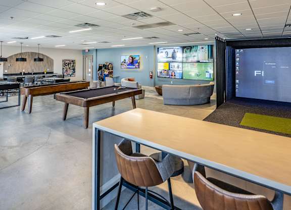 A conference room with a long table and chairs.