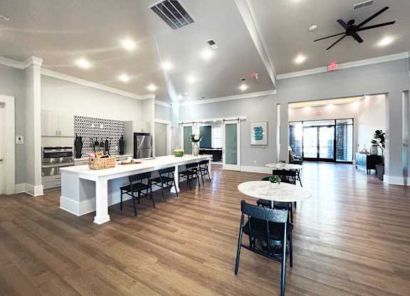 a large living room with a dining room and a kitchen