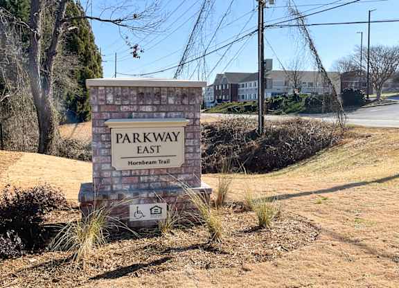 A sign for Parkway East with a handicap symbol.