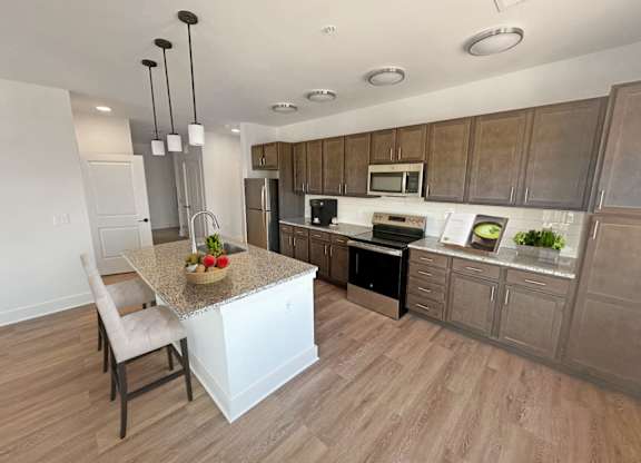 Gordon Street Lofts Kitchen with Stainless Steel Appliances,