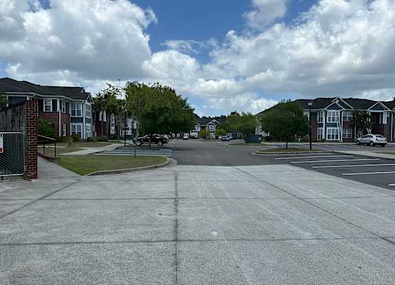 an empty street in a suburban neighbourhood with houses