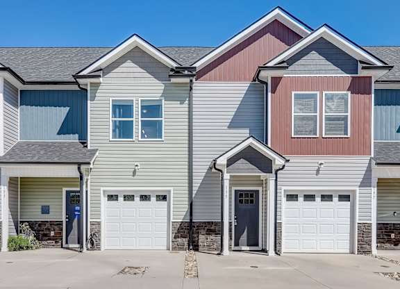 a gray and with two garage doors