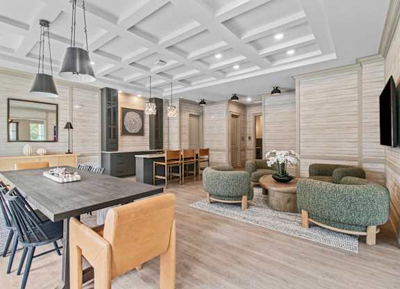 A modern dining room with a wooden table and chairs.