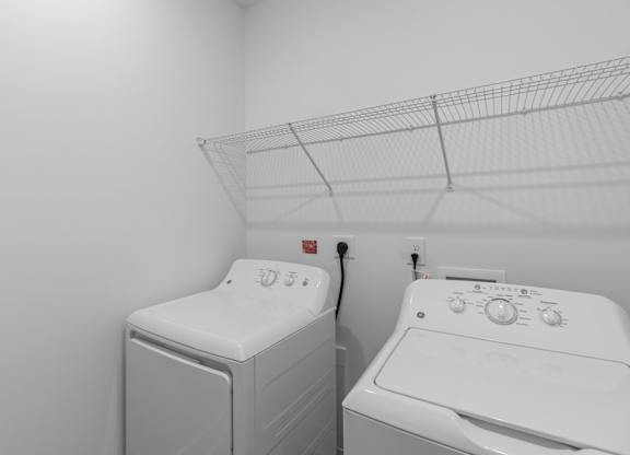A laundry room with a washer and dryer.