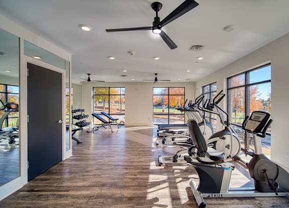 500 Northside Station Apartments Gym with treadmill, ellipticals. a stationary bike and free weights