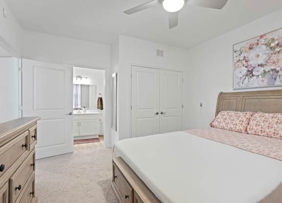 Ovata at Reedy Creek bedroom with carpet and ceiling fan