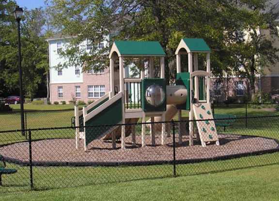 a playground with a slide and other playground equipment