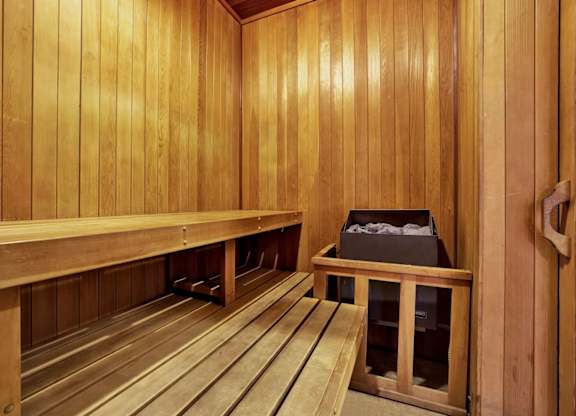 A sauna with wooden benches and walls at Midvale Court, Los Angeles