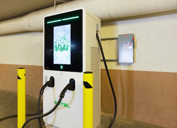 A charging station for electric vehicles is shown with a digital display. at Midvale Court, Los Angeles
