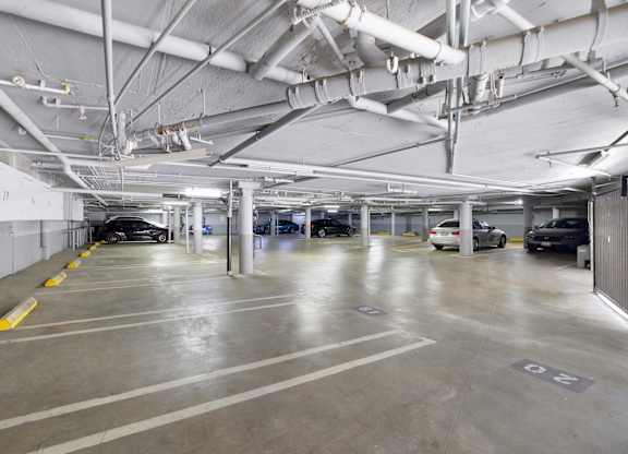 Parking garage with vehicles. at The Hilgard, Los Angeles