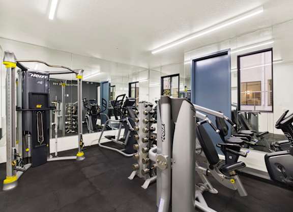 A gym with a variety of equipments.