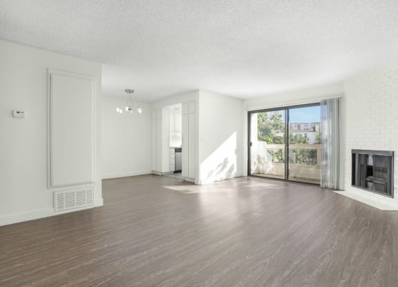 Apartment living room, dining area, fireplace and balcony