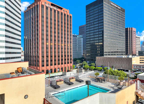 View of buildings and a pool in the foreground.