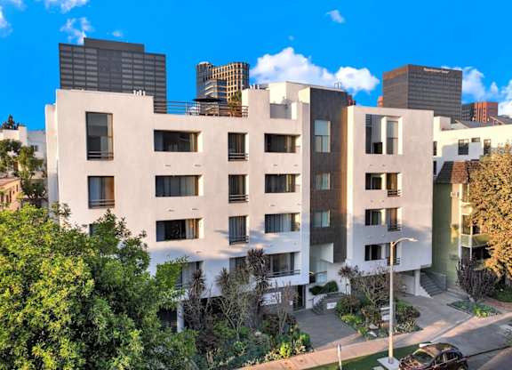 Exterior view of apartment building across the street at Park Rochester, Los Angeles, CA, 90024.