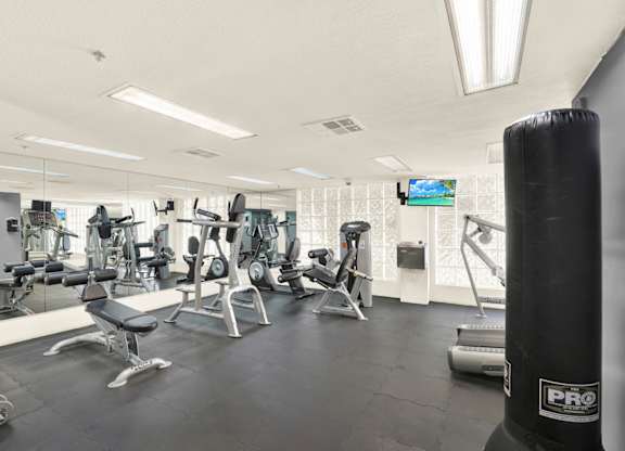 A gym with various exercise equipment at Midvale Towers, California, 90024