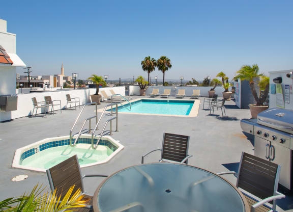 Apartment roof terrace with patio furniture, spa and pool. at Midvale Court, Los Angeles, CA