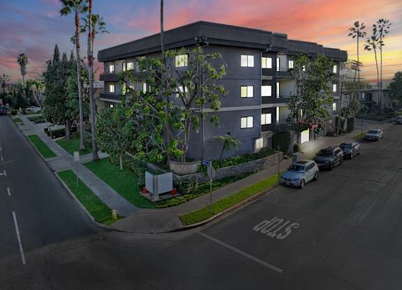 A street view of a residential area with cars parked on the side of the road at Twelve One Ten Rochester, Los Angeles, California