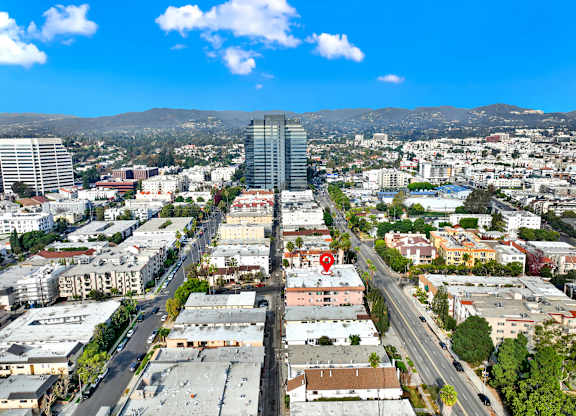 A cityscape with a red marker on a building at Twelve One Ten Rochester, Los Angeles, California
