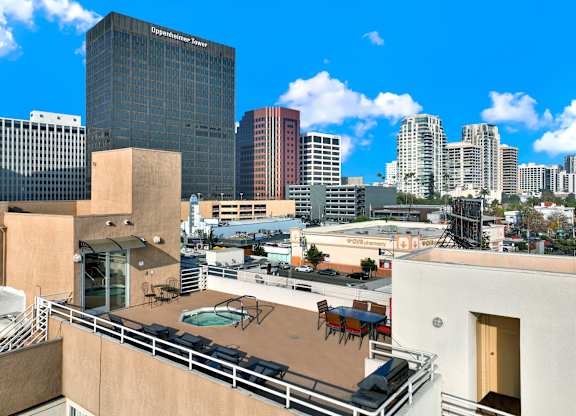 A view of a cityscape with a pool on the balcony of a building at Peach Tree Court, Los Angeles, 90024