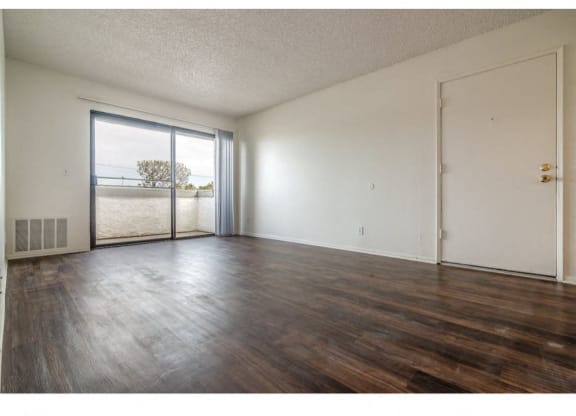 Living Area With Balcony at Costa Mesa Family Village, Costa Mesa, California