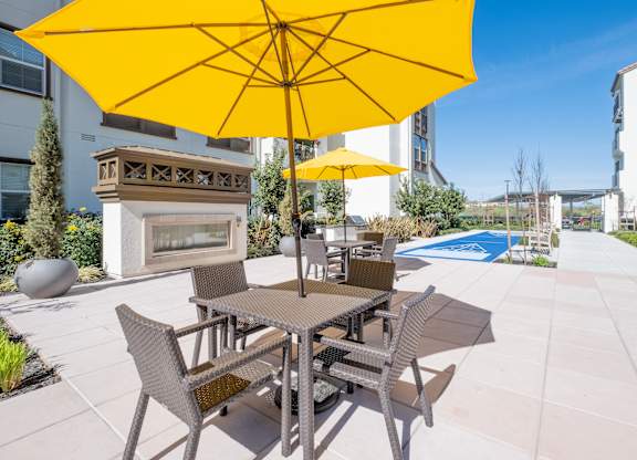 Outdoor lounge and game area at Deer Creek Senior Apartments in San Ramon, CA 94582