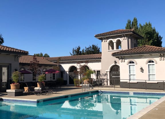 a house with a swimming pool in front of it  at Falcon Bridge at Gale Ranch, San Ramon, CA